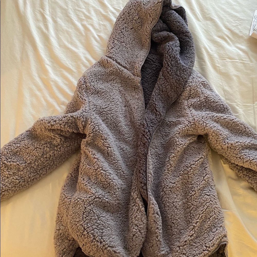 Very soft and cozy teddy like sweater.